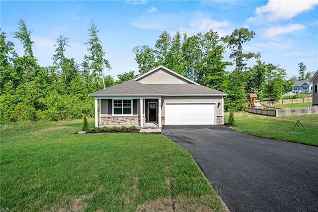 view of front of house featuring a front lawn and a garage