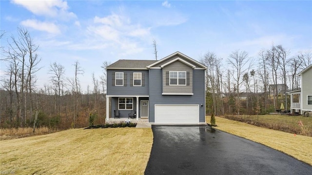 front of property featuring a garage and a front lawn