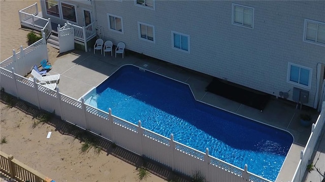 view of pool featuring a patio area