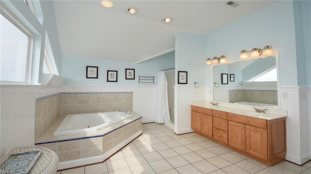 bathroom with vanity, tile patterned floors, and plus walk in shower