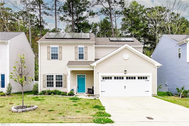 view of front of property with solar panels, a front yard, and a garage