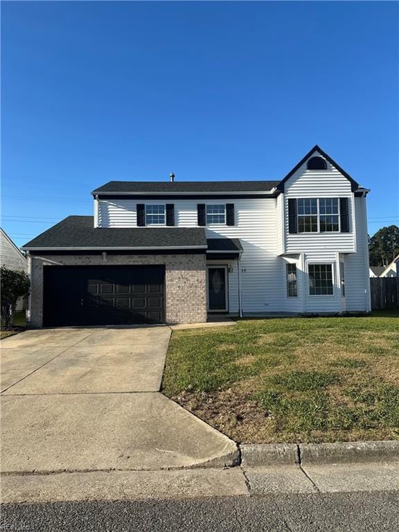 view of front property with a front lawn and a garage