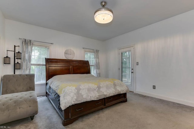 bedroom with light colored carpet