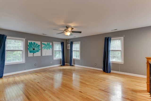 spare room with light hardwood / wood-style flooring and ceiling fan