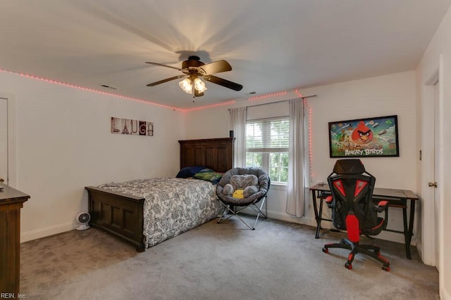 bedroom featuring ceiling fan and light carpet