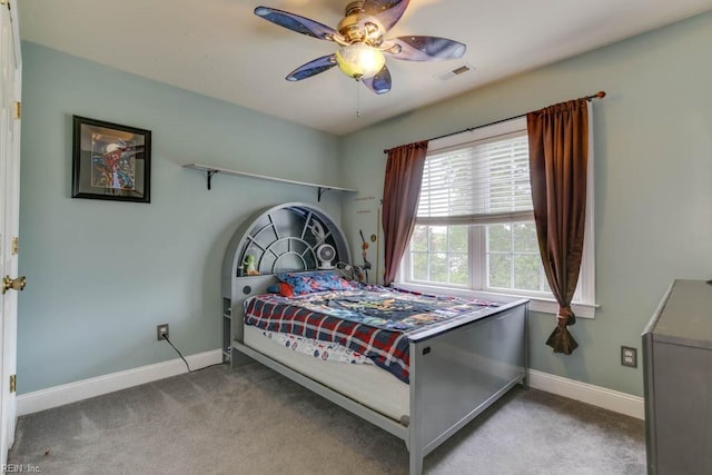 bedroom featuring light carpet and ceiling fan