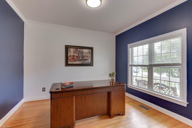 office area featuring ornamental molding and light hardwood / wood-style floors