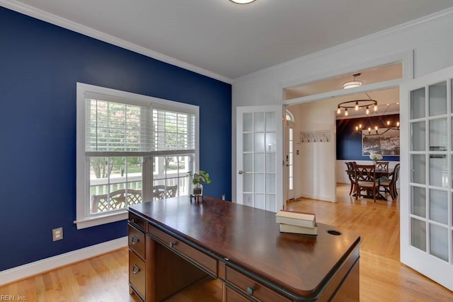 office featuring light hardwood / wood-style flooring, french doors, a chandelier, and crown molding