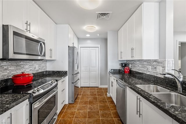 kitchen featuring white cabinetry and stainless steel appliances