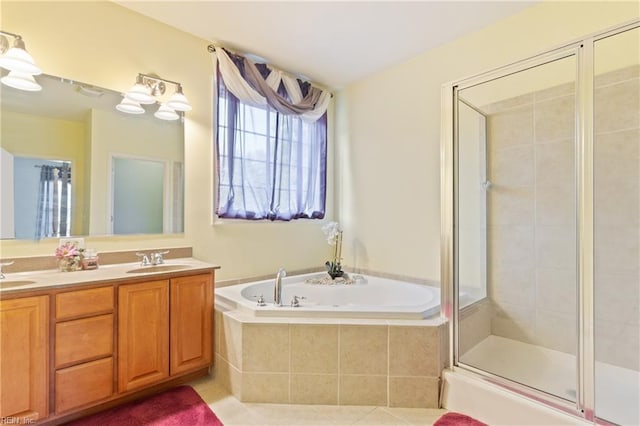 bathroom with vanity, tile patterned floors, and plus walk in shower