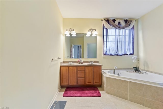 bathroom with vanity, a relaxing tiled tub, and tile patterned floors