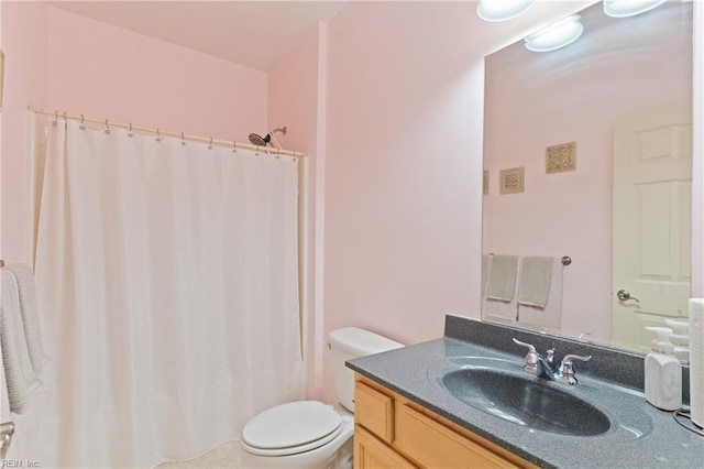 bathroom featuring vanity, a shower with curtain, and toilet