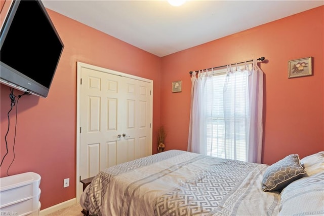 bedroom featuring a closet and carpet flooring