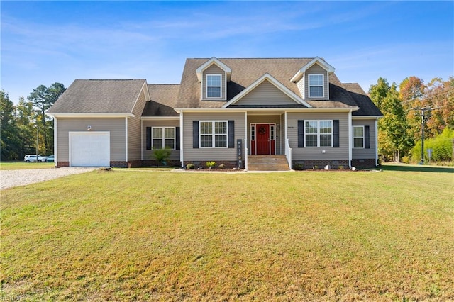 view of front of home featuring a front yard and a garage