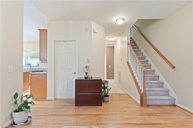 staircase featuring hardwood / wood-style floors