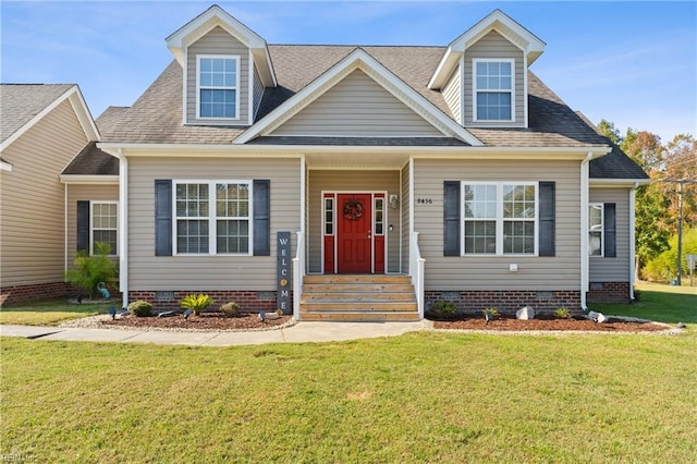 cape cod-style house with a front yard