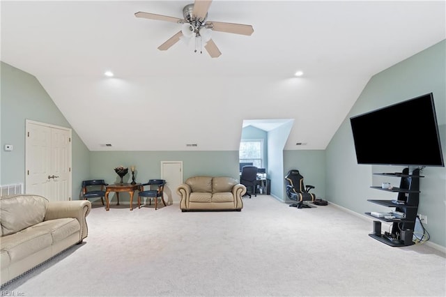 carpeted living room with ceiling fan and lofted ceiling