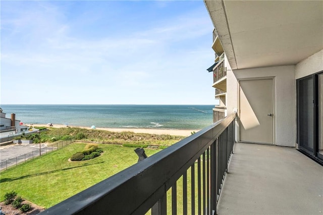 balcony with a view of the beach and a water view