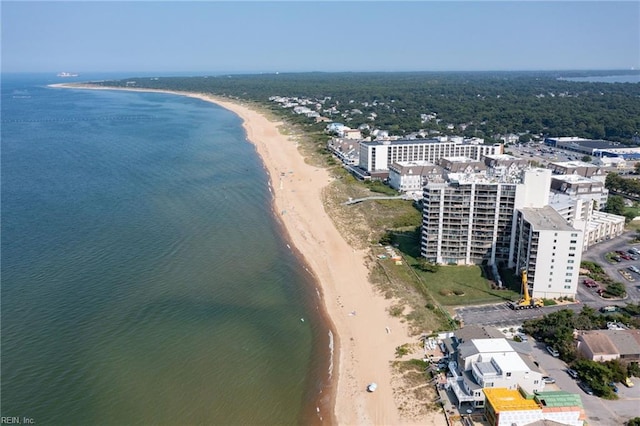 birds eye view of property featuring a water view and a view of the beach