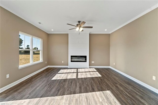 unfurnished living room featuring dark wood-type flooring, crown molding, and ceiling fan