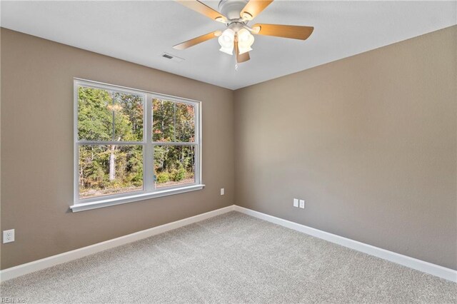 unfurnished room featuring carpet and ceiling fan