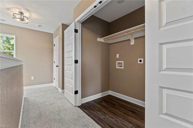 clothes washing area with hookup for an electric dryer, dark wood-type flooring, and washer hookup