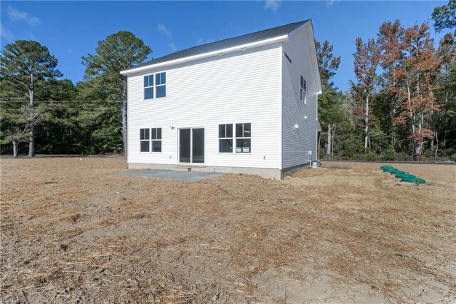 back of property with a patio