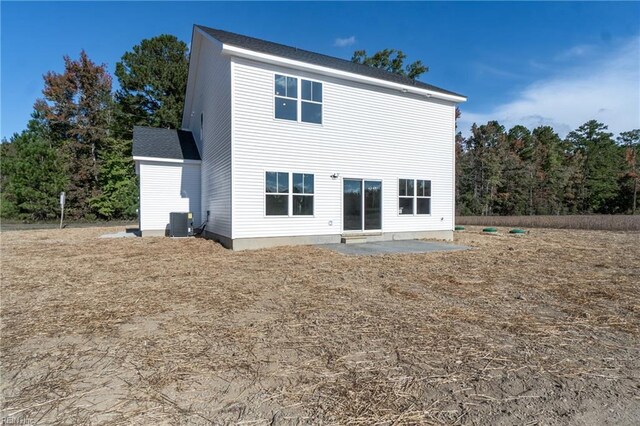 rear view of property with a patio and central AC unit