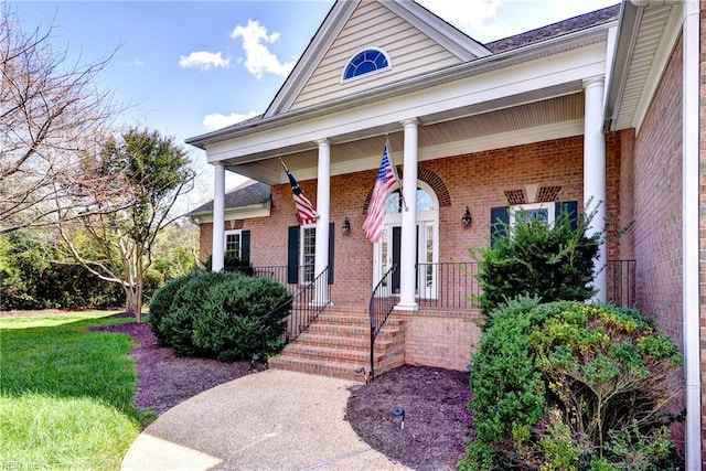 doorway to property featuring covered porch