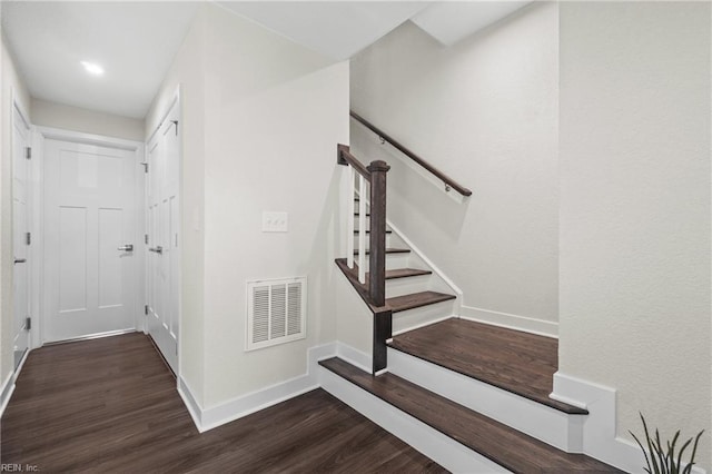 stairs with hardwood / wood-style flooring