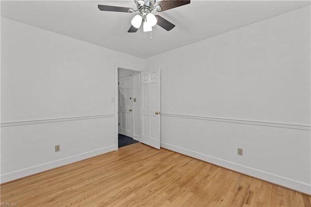 empty room featuring ceiling fan and light hardwood / wood-style flooring