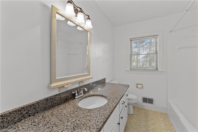 full bathroom with  shower combination, vanity, and toilet