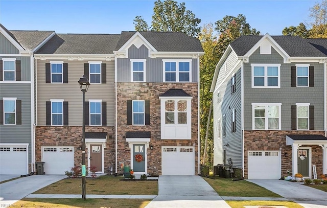 townhome / multi-family property featuring a garage