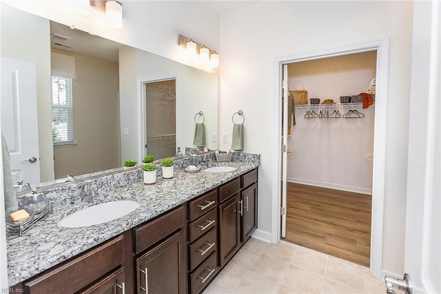 bathroom with vanity and hardwood / wood-style flooring