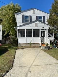 view of front of home featuring a sunroom