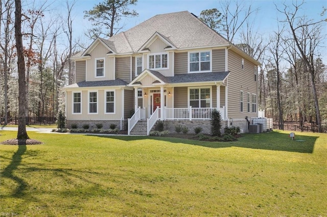 craftsman-style house with a front yard, covered porch, and central air condition unit