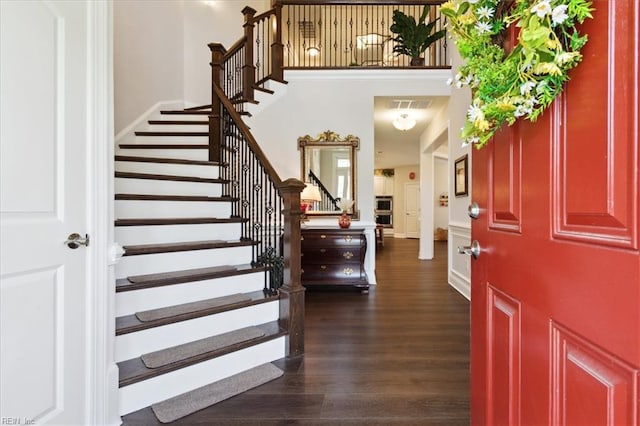 foyer with dark hardwood / wood-style flooring