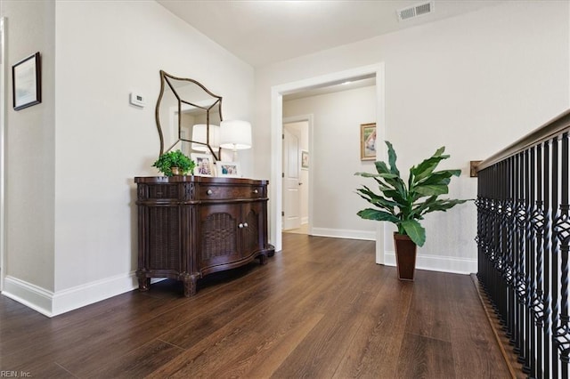 hallway featuring dark hardwood / wood-style floors