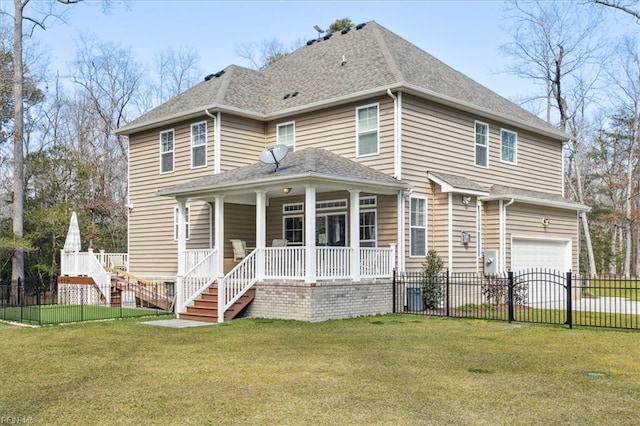 view of front facade with a front yard, covered porch, and a garage