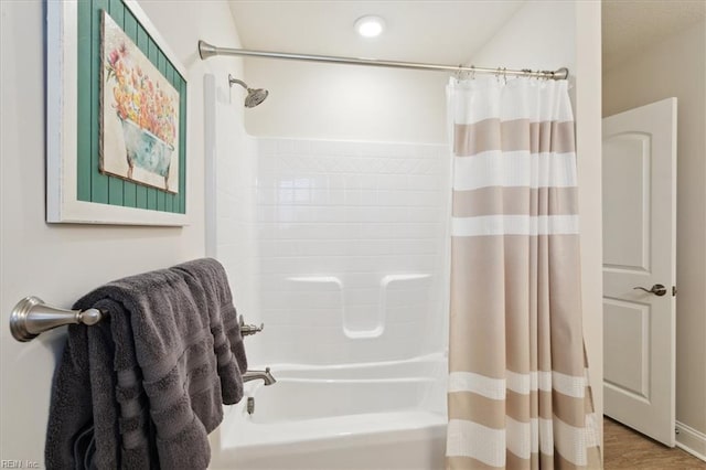 bathroom featuring shower / tub combo with curtain