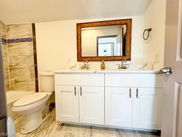 full bathroom featuring vanity, toilet, and independent shower and bath