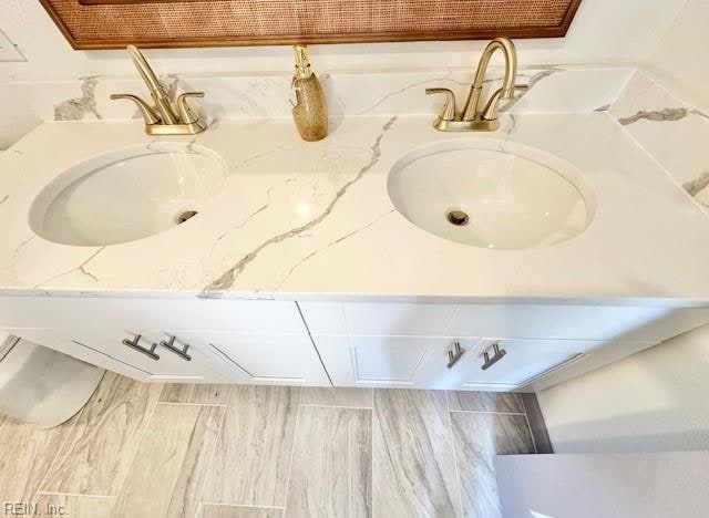 bathroom featuring vanity and wood-type flooring