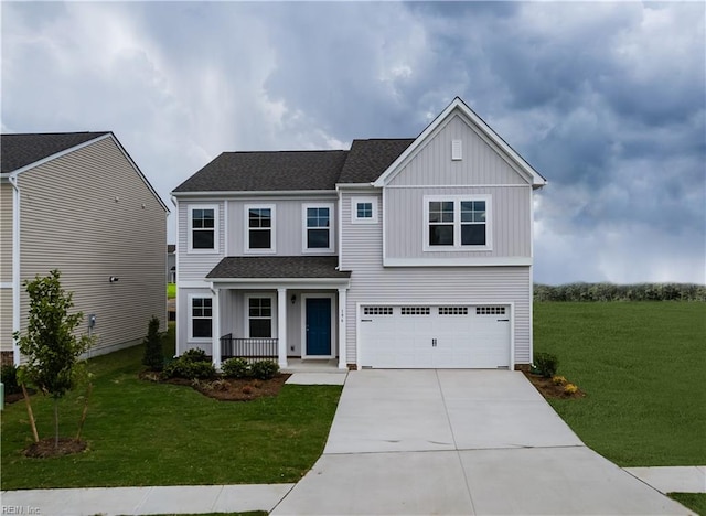 view of front of property with a garage and a front lawn