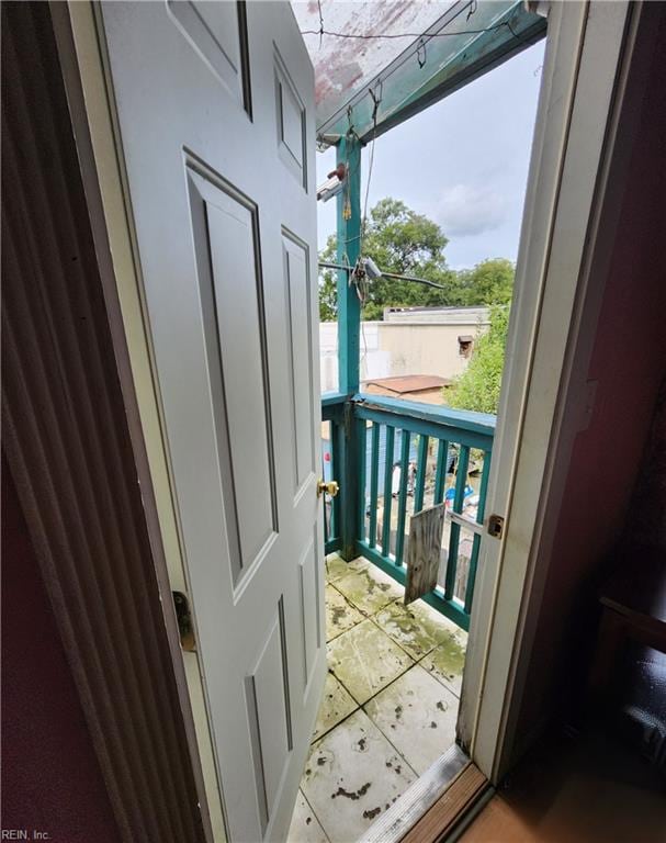 doorway to outside featuring light tile patterned floors