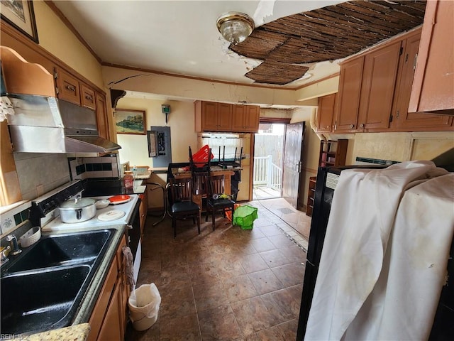 kitchen featuring tasteful backsplash and sink