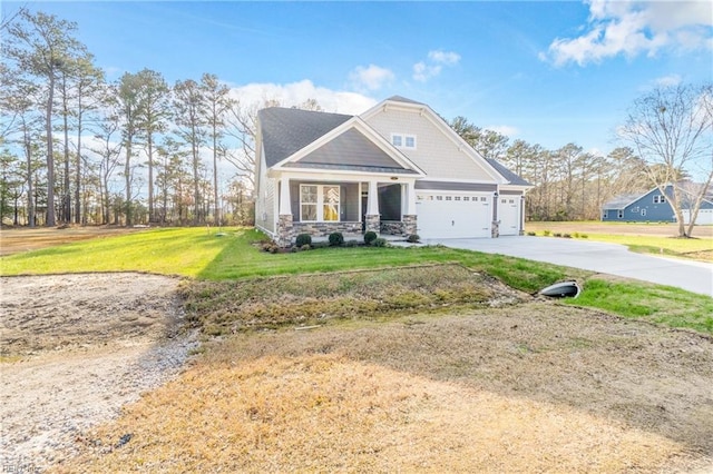 craftsman-style home featuring a front yard, a garage, and a porch