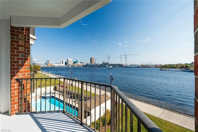 balcony featuring a water view