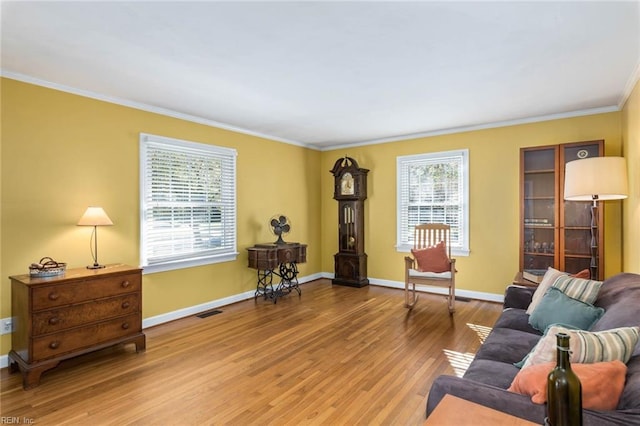 living room with ornamental molding and wood-type flooring