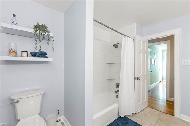 bathroom with toilet, shower / tub combo, and hardwood / wood-style floors