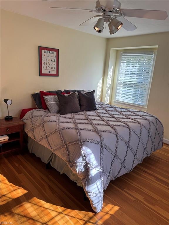 bedroom with hardwood / wood-style floors and ceiling fan